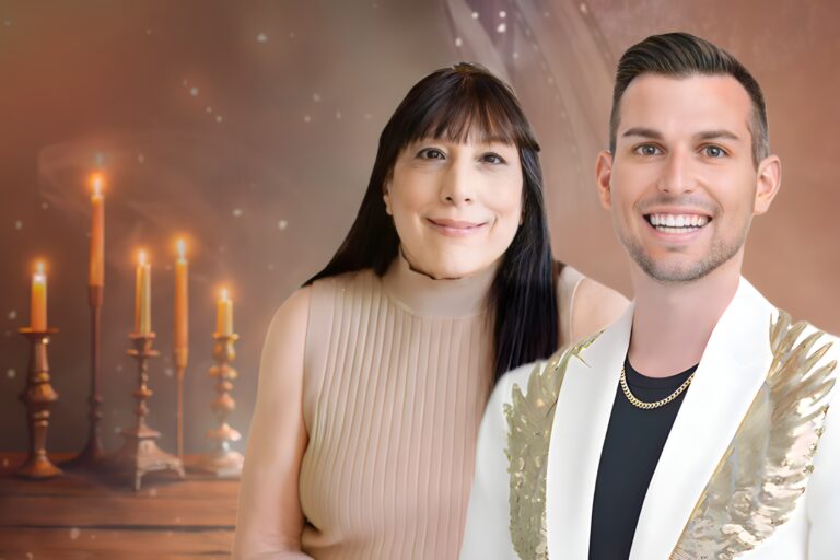 Matt Fraser and Angela Fraser together, smiling at the camera. Lit candles glow behind them against a soft-lit brown background.